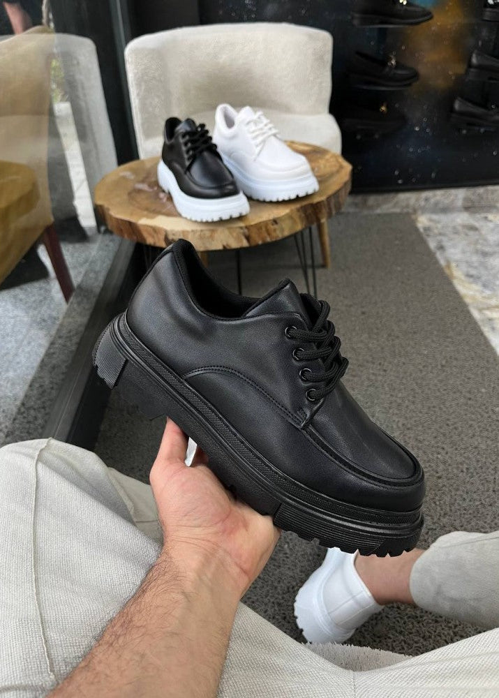 Vantage Prime all-black elevating sneaker by Apollo Moda, third angle