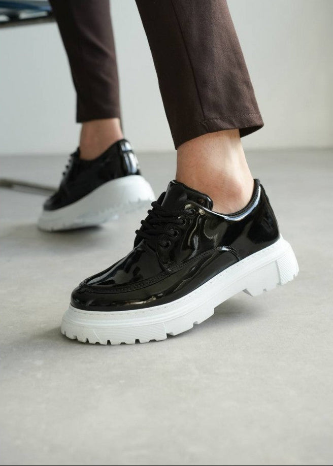 Vantage Line gloss black sneaker with white height-boosting sole by Apollo Moda, third angle